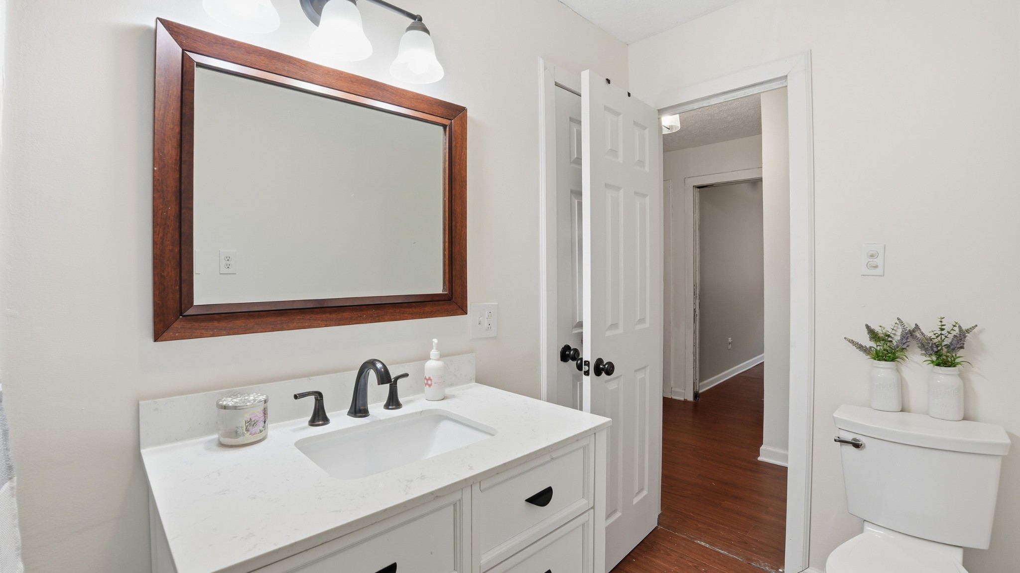 7610 Highway 50 Pelham, TN 37366 - Photo 22 of 46 a bathroom with a sink vanity and a mirror