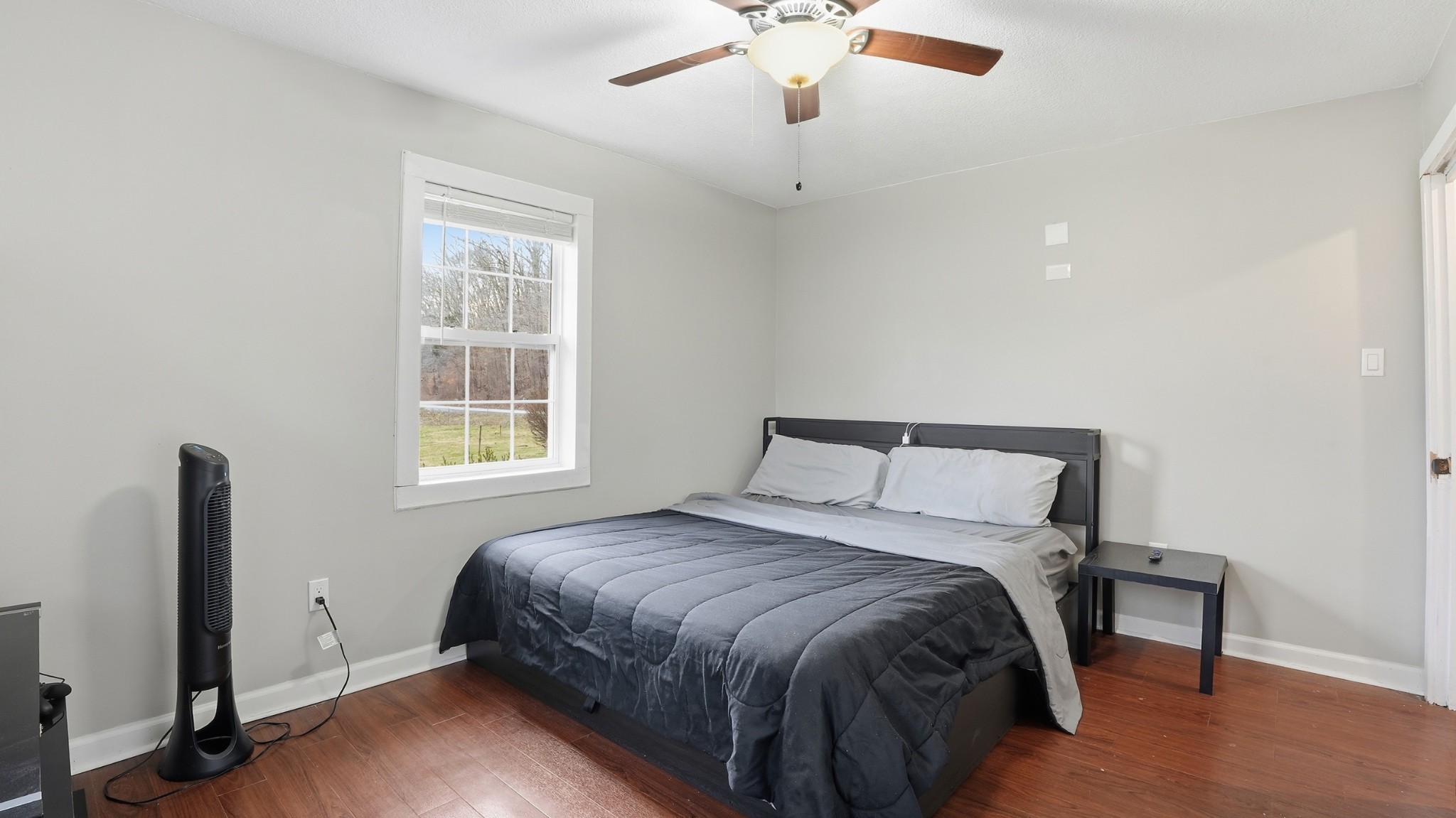 7610 Highway 50 Pelham, TN 37366 - Photo 25 of 46 a bedroom with a bed and a window