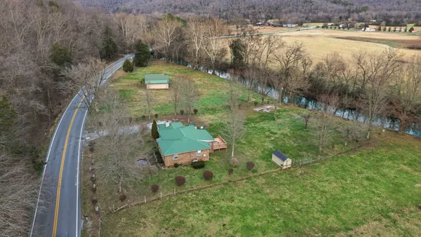 a view of a lake with a yard
