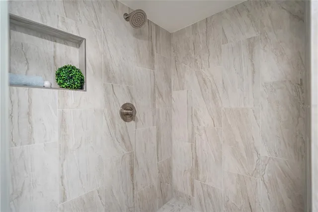 a bedroom with a bed and a hallway