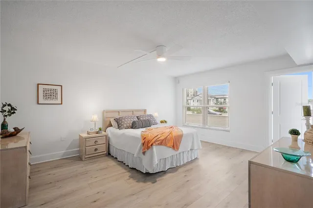 a living room with furniture and paintings on the wall
