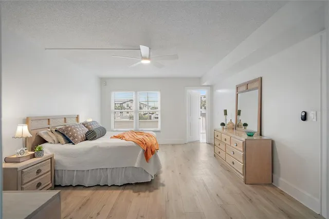 a living room with furniture a bed and a lamp