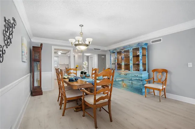 a view of staircase with wooden floor and white walls