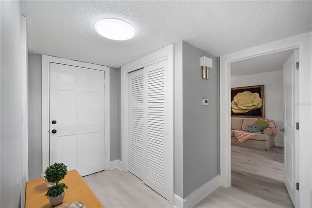a view of a dining room with lots of tables and glass windows