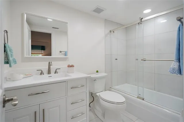 a kitchen with granite countertop a sink and cabinets