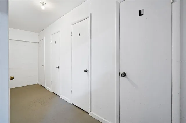 an aerial view of multi story residential apartment building with yard