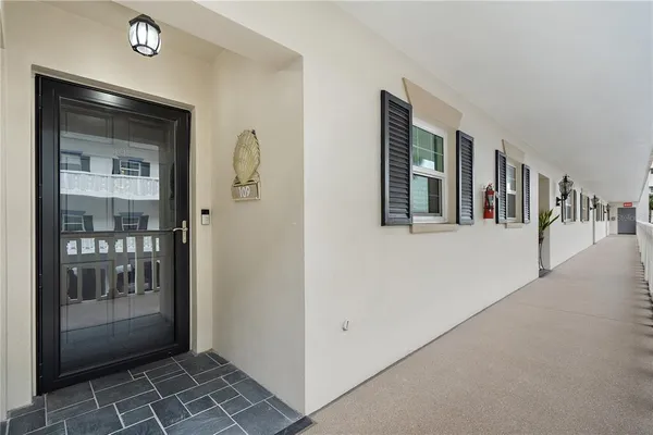 a kitchen with refrigerator and window