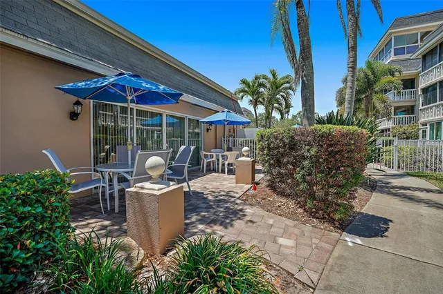 a front view of a building with parking