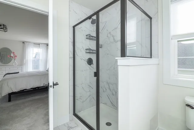 a bathroom with a tub and shower