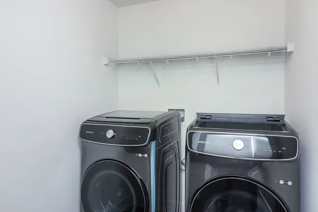 a utility room with dryer and washer