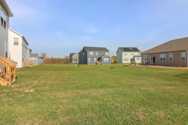 a view of a big room with table and chairs