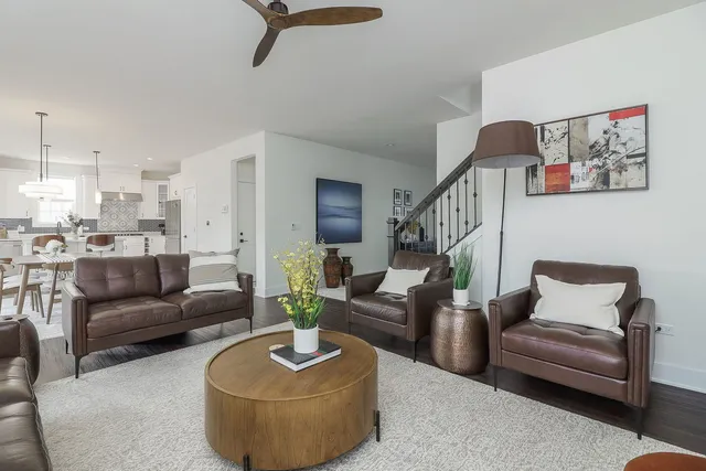 a living room with furniture and a potted plant