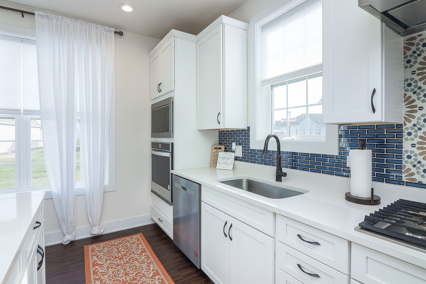 3539 Crosswater Court Elgin, IL 60124 - Photo 10 of 26 a kitchen with stainless steel appliances granite countertop a sink stove and cabinets