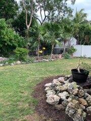 919 Lobster Lane Key Largo, FL 33037 - Photo 11 of 21 a view of a backyard with plants and a garden