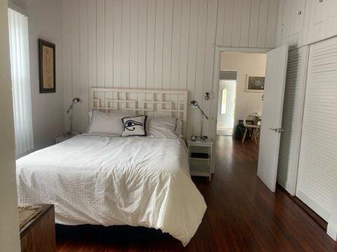919 Lobster Lane Key Largo, FL 33037 - Photo 14 of 21 a bedroom with a bed and wooden floor