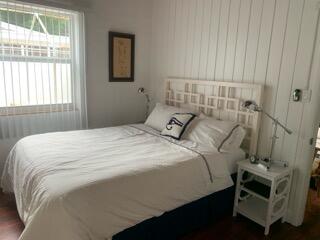 919 Lobster Lane Key Largo, FL 33037 - Photo 15 of 21 a bedroom with a bed and a window