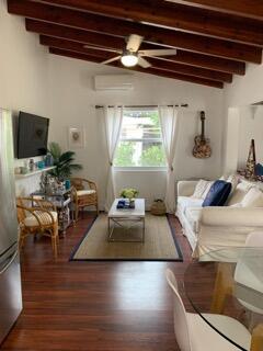 919 Lobster Lane Key Largo, FL 33037 - Photo 4 of 21 a living room with furniture and a flat screen tv