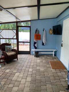 919 Lobster Lane Key Largo, FL 33037 - Photo 9 of 21 a room with gym equipment and a flat screen tv