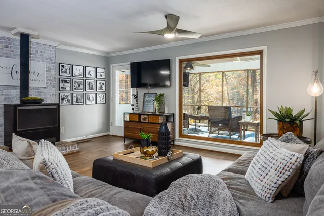 a living room with furniture and a flat screen tv