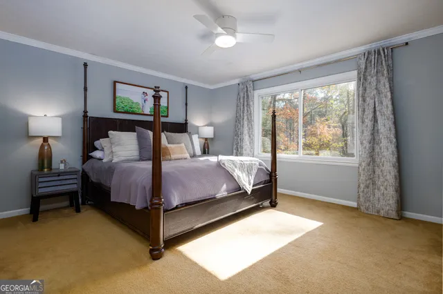 a bedroom with a bed and a night stand