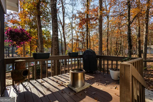 a view of a chairs and table in the balcony