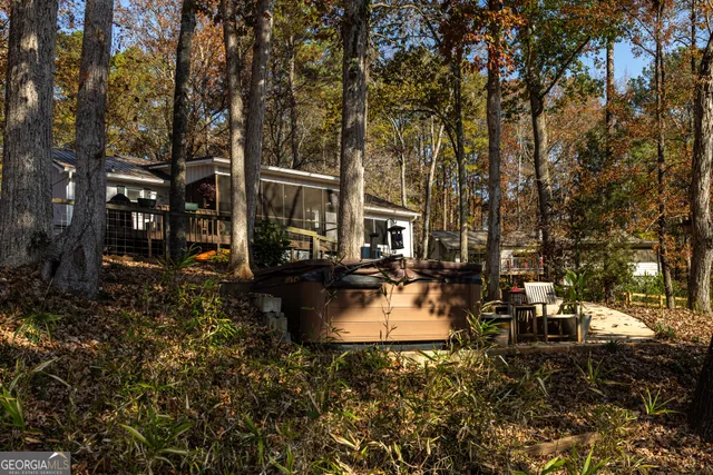 a view of a patio with table and chairs and potted plants