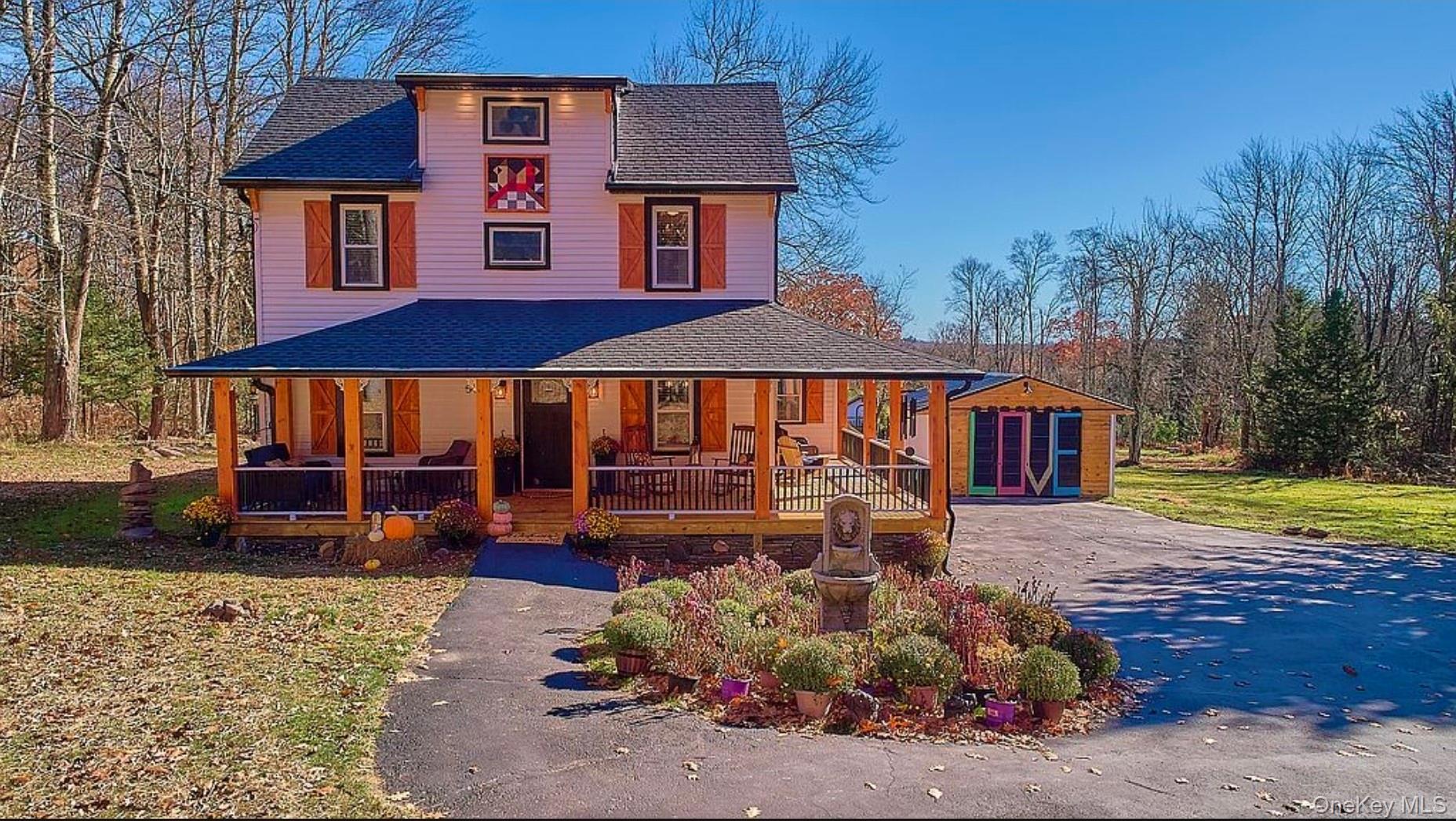 541 Cold Spring Road Monticello, NY 12701 - Photo 1 of 31 a front view of a house with garden