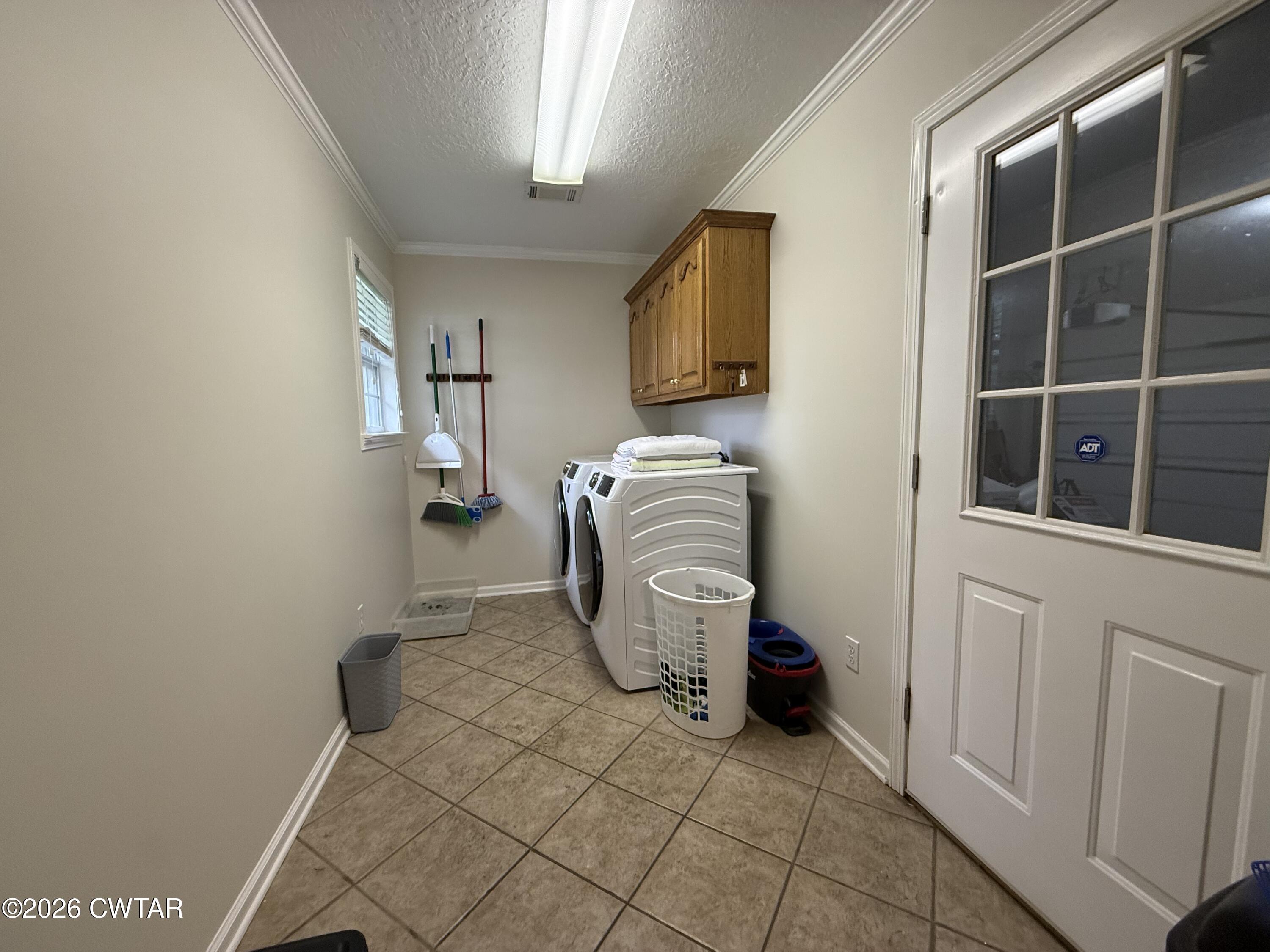 126 Waldunn Cove Rutherford, TN 38369 - Photo 15 of 18 a room with a washing machine and a flat screen tv