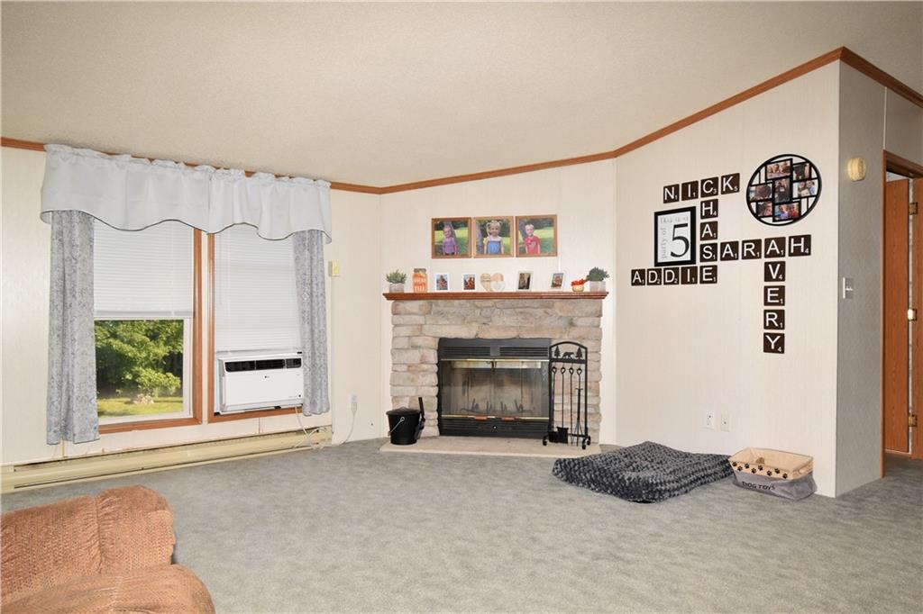 478 Hadley Road Greenville, PA 16125 - Photo 5 of 15 a view of livingroom with furniture and a fireplace