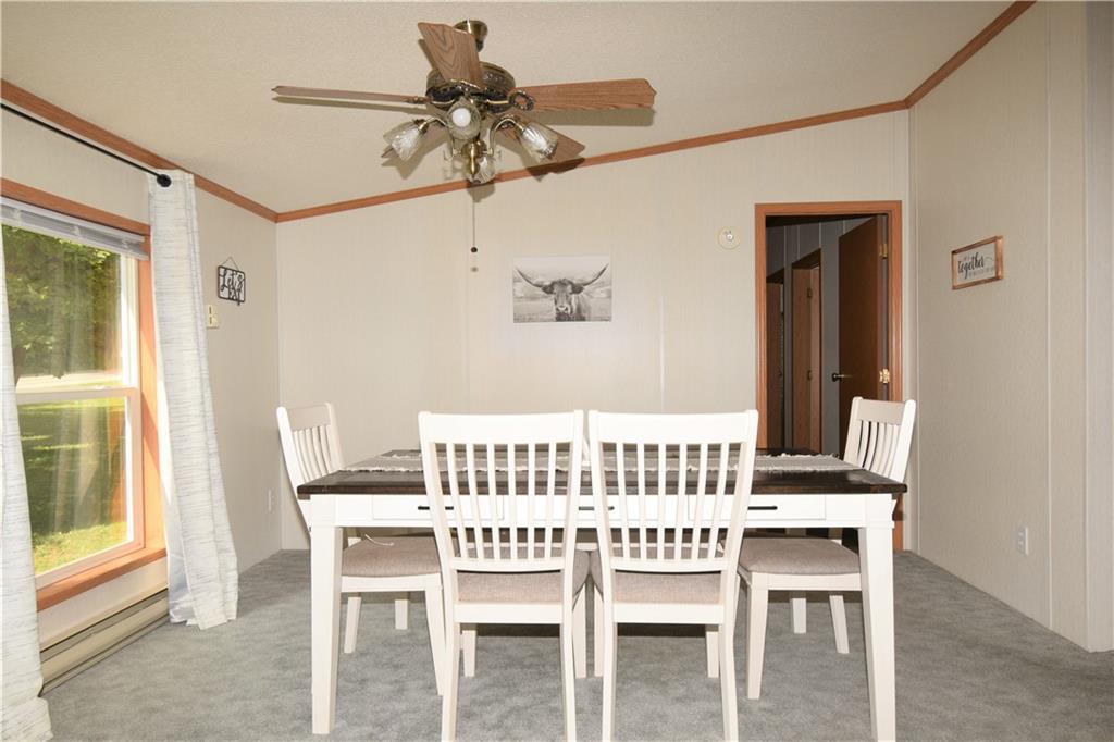 478 Hadley Road Greenville, PA 16125 - Photo 7 of 15 a view of a dining room with furniture and a chandelier