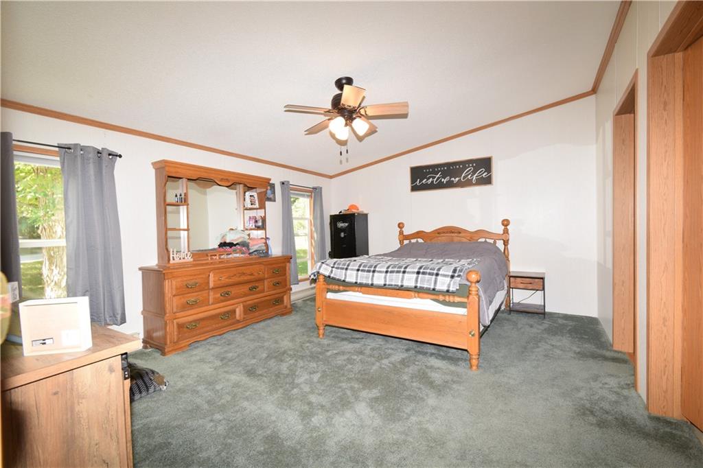 478 Hadley Road Greenville, PA 16125 - Photo 8 of 15 a living room with furniture a flat screen tv and a dresser