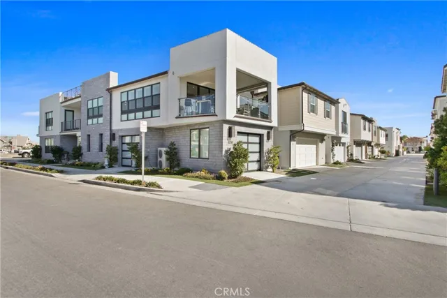 a living room with furniture potted plant and a large window