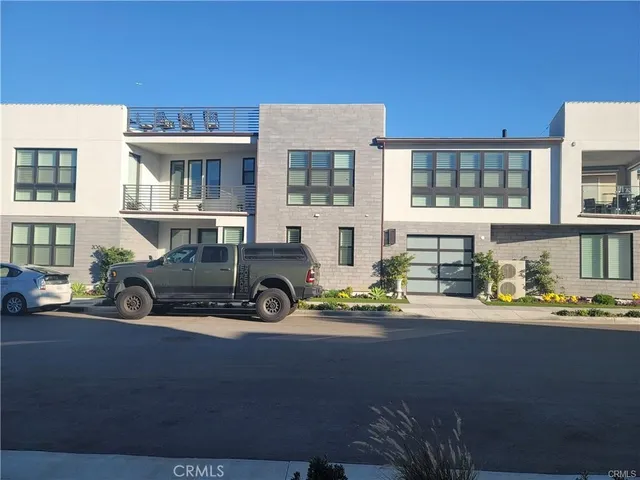 a large kitchen with a table and chairs