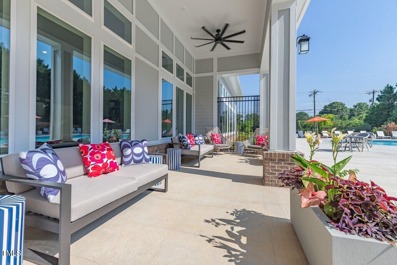 3520 Pinetree Grove Lane, Unit A1 Raleigh, NC 27604 - Photo 14 of 26 a living room filled with furniture and flowers