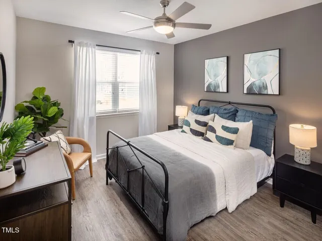 a bedroom with bed and a window