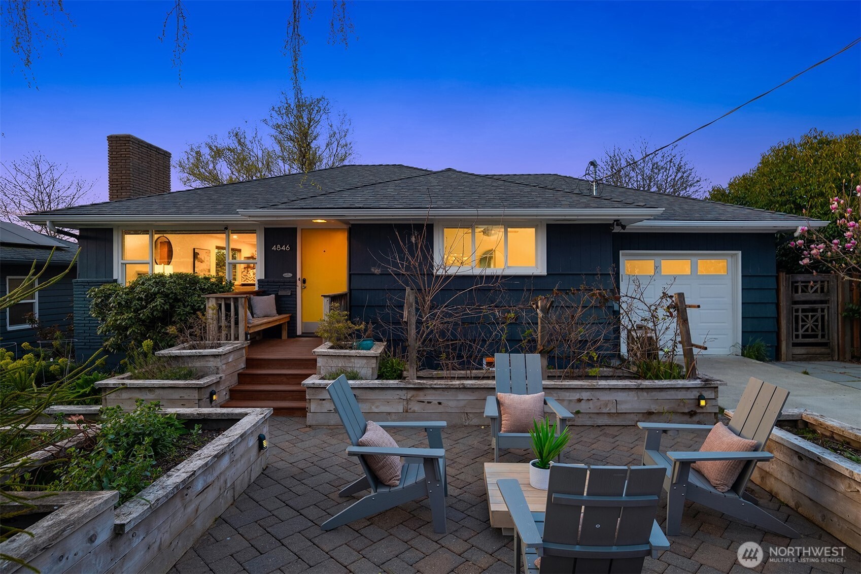 4846 South Juneau Street Seattle, WA 98118 - Photo 1 of 38 a view of a house with patio outdoor seating