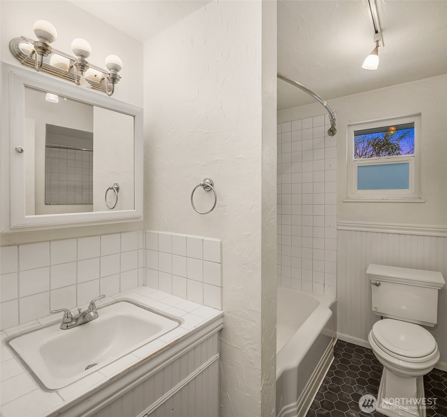 4846 South Juneau Street Seattle, WA 98118 - Photo 15 of 38 a bathroom with a sink toilet and shower