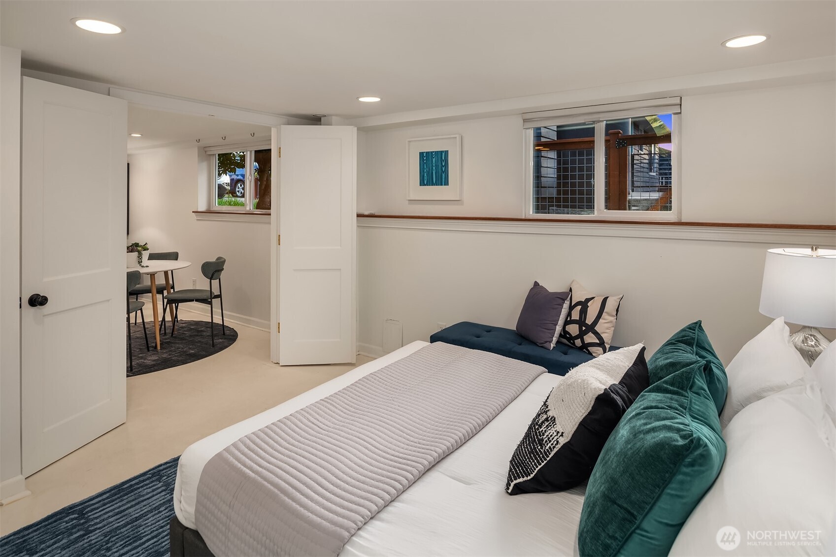 4846 South Juneau Street Seattle, WA 98118 - Photo 21 of 38 a bedroom with a bed and wooden floor