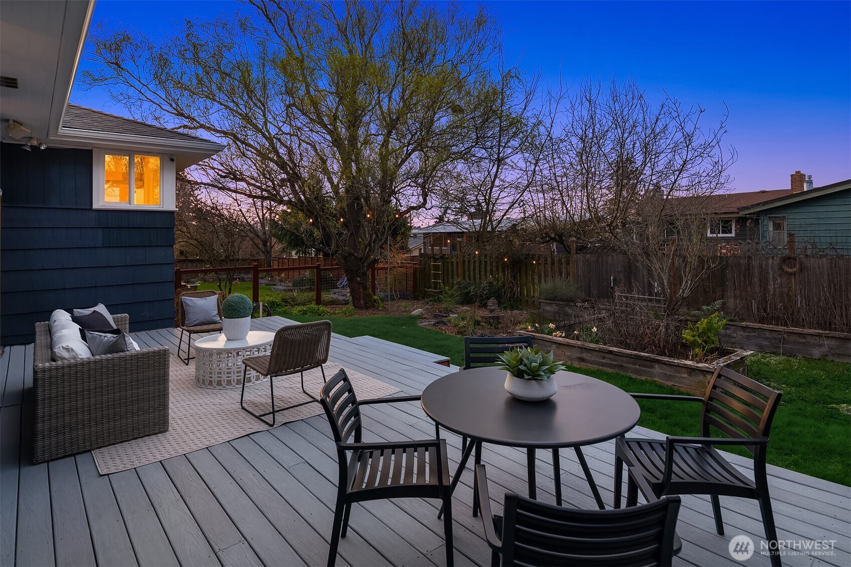 4846 South Juneau Street Seattle, WA 98118 - Photo 31 of 38 a view of a patio with a dining table and chairs with a fire pit and a fire pit