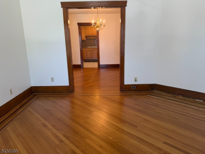 72 Baldwin Place, Unit 2 Bloomfield, NJ 07003 - Photo 13 of 24 a view of empty room with wooden floor