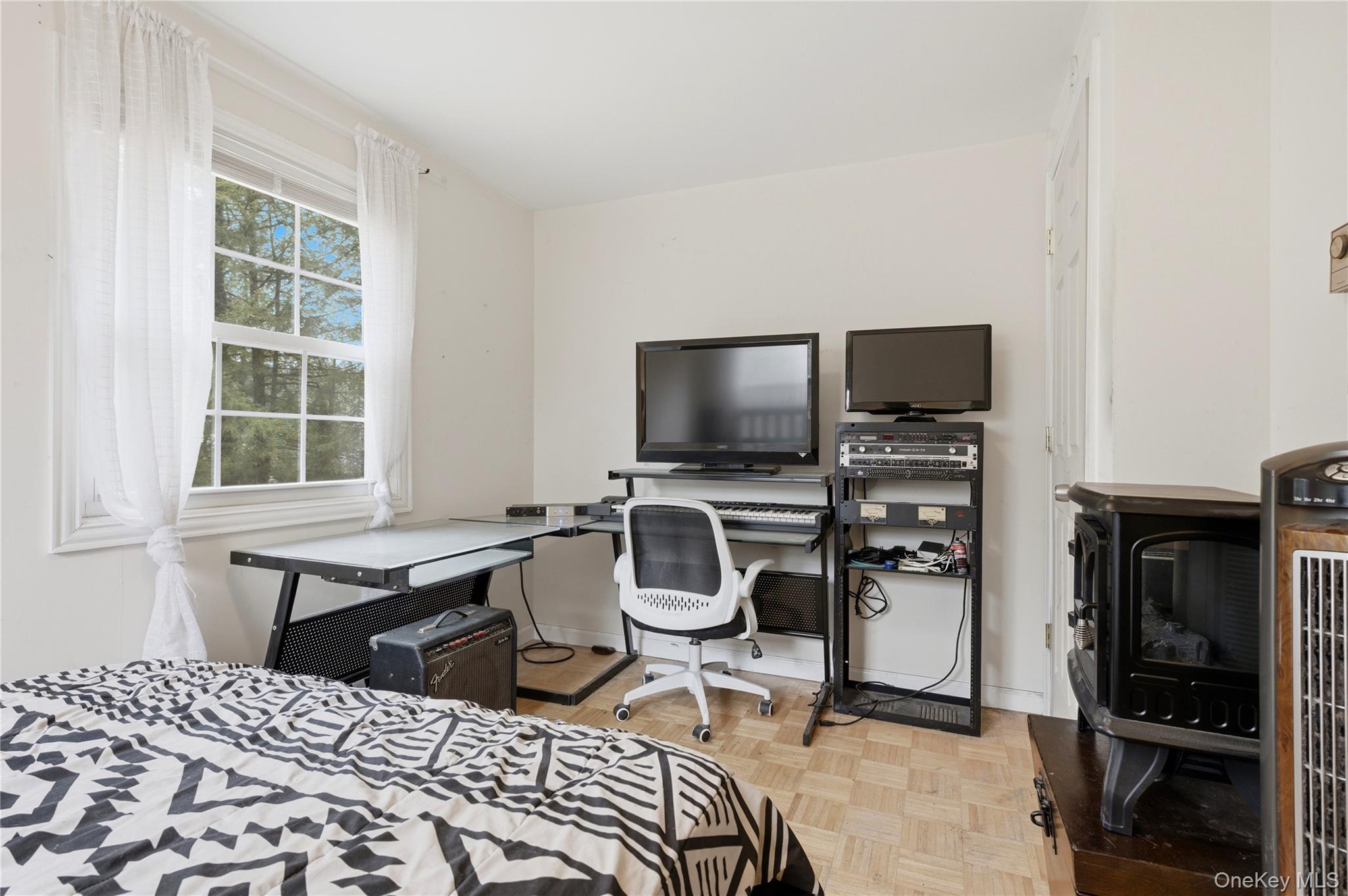 35 Quiat Road Mountain Dale, NY 12763 - Photo 14 of 27 Bedroom with a wood stove, parquet floors, and a desk