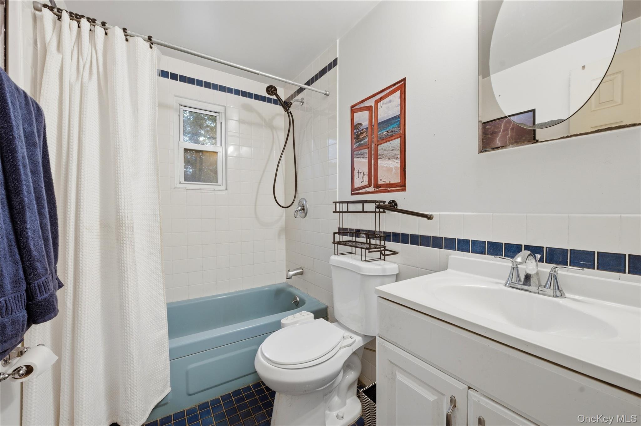 35 Quiat Road Mountain Dale, NY 12763 - Photo 21 of 27 Full bath with vanity, tile walls, shower / bath combo, and wainscoting