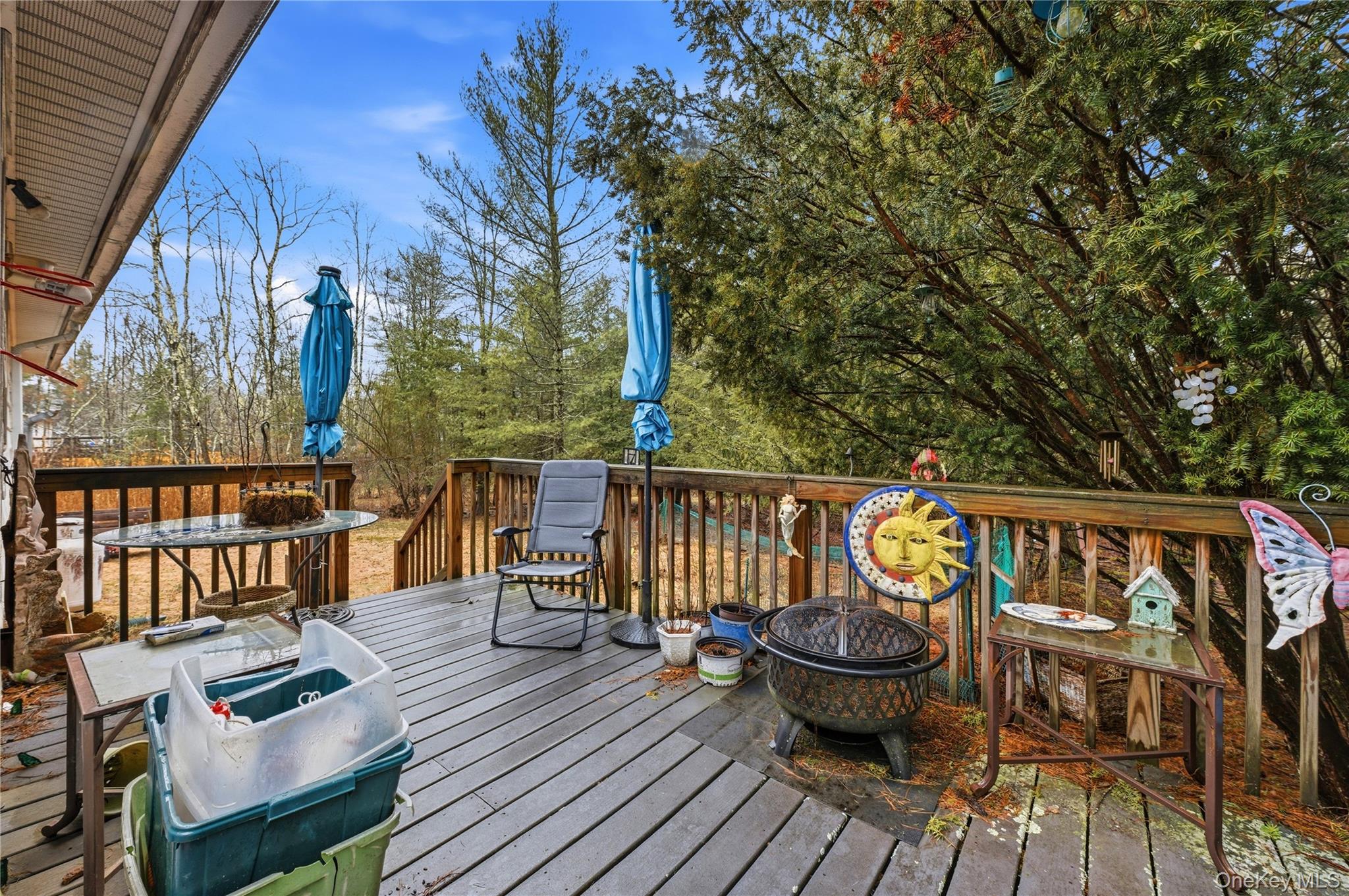 35 Quiat Road Mountain Dale, NY 12763 - Photo 25 of 27 Wooden terrace with grilling area, an outdoor fire pit, and outdoor dining space