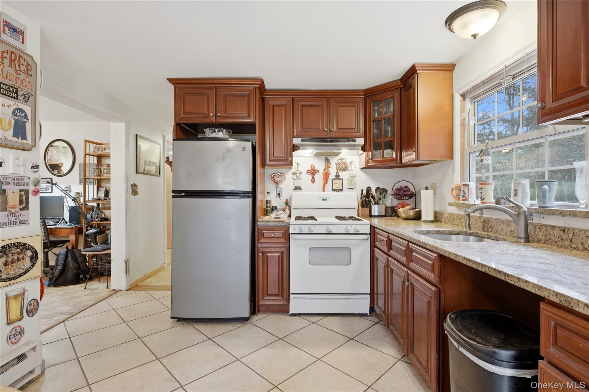 35 Quiat Road Mountain Dale, NY 12763 - Photo 5 of 27 Kitchen featuring white gas range oven, freestanding refrigerator, light stone counters, glass fronted cabinets, and wood finish cabinetry