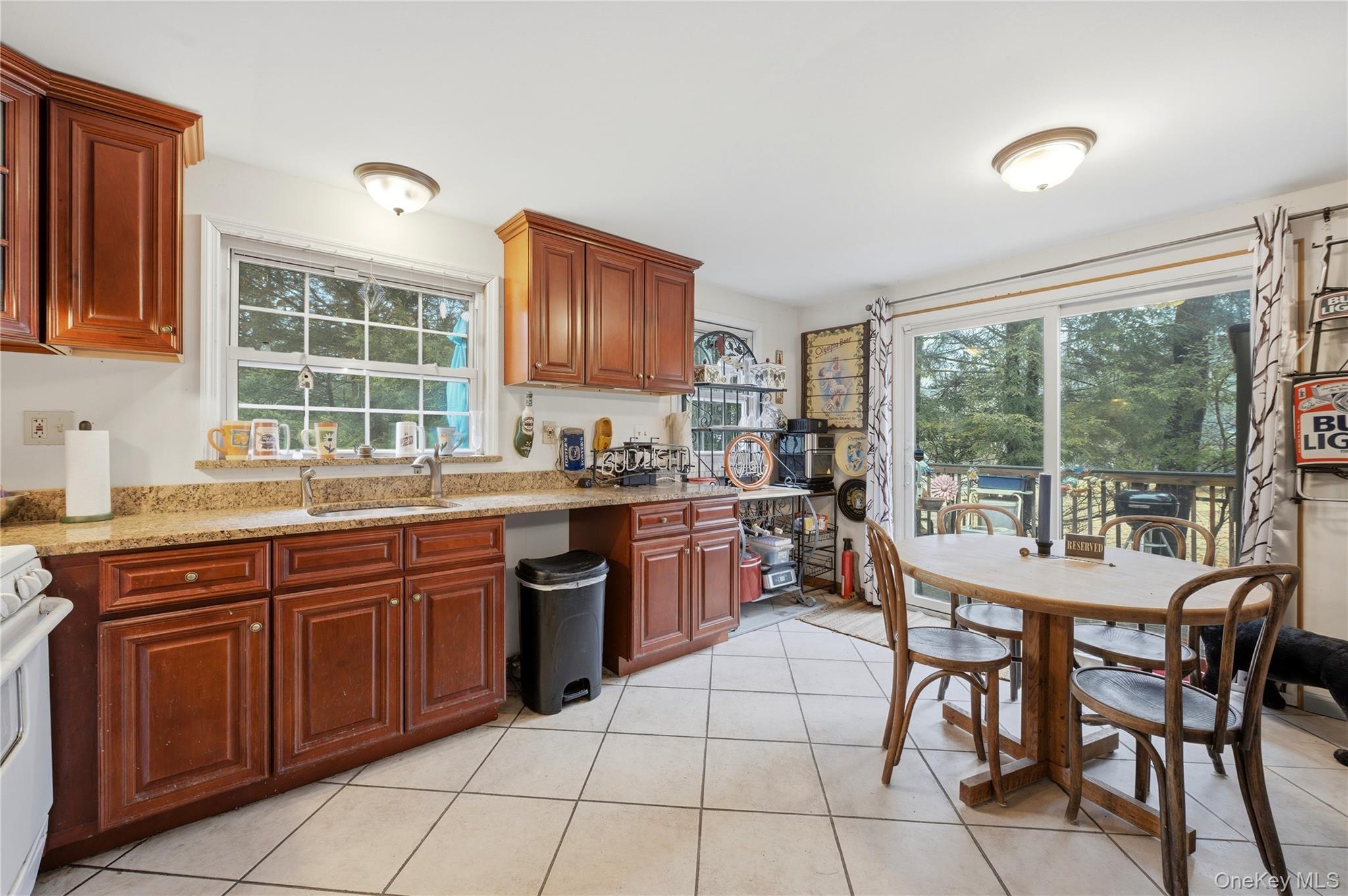 35 Quiat Road Mountain Dale, NY 12763 - Photo 7 of 27 Kitchen featuring light stone counters, light tile patterned flooring, white range oven, and glass insert cabinets