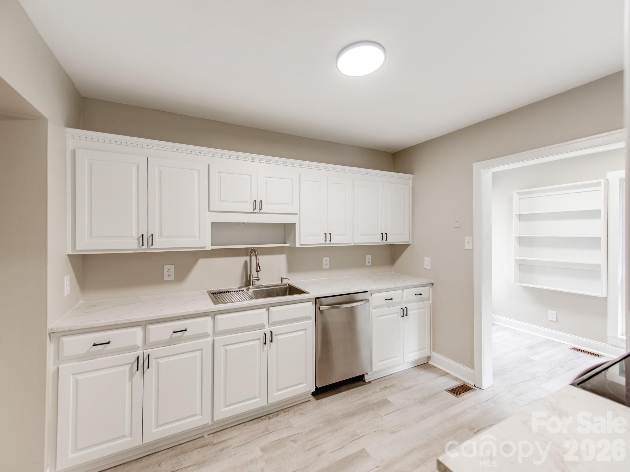 4699 Cherrystone Road Lancaster, SC 29720 - Photo 10 of 28 a kitchen with a sink cabinets and window