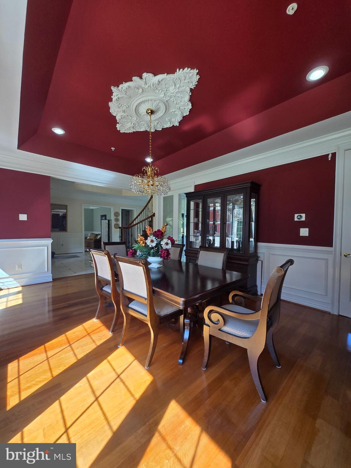 7145 Brooks Road Highland, MD 20777 - Photo 13 of 89 a living room with furniture a chandelier and a floor to ceiling window