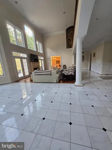 an empty room with wooden floor and closet