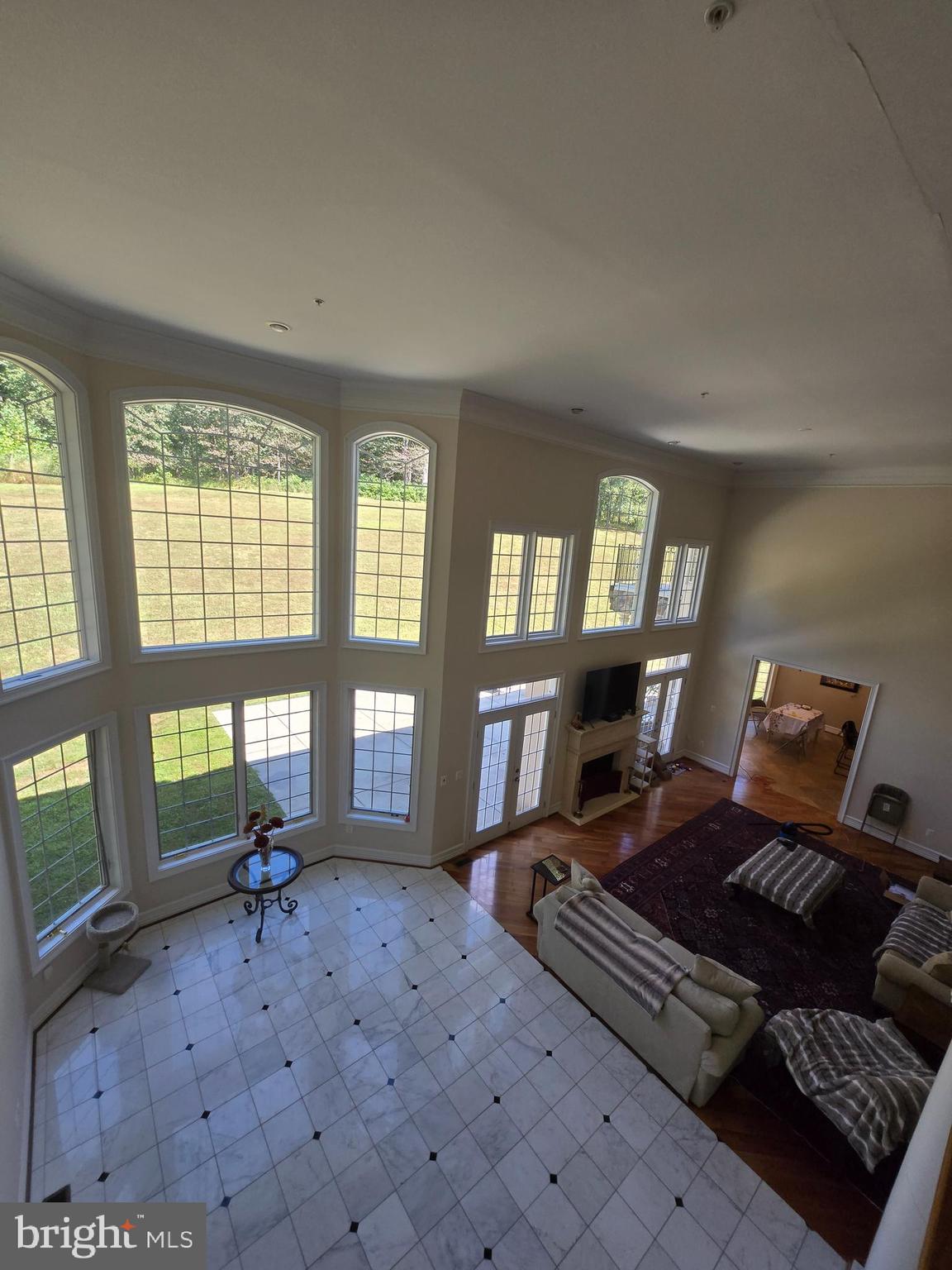 7145 Brooks Road Highland, MD 20777 - Photo 23 of 89 a living room with furniture and a floor to ceiling window