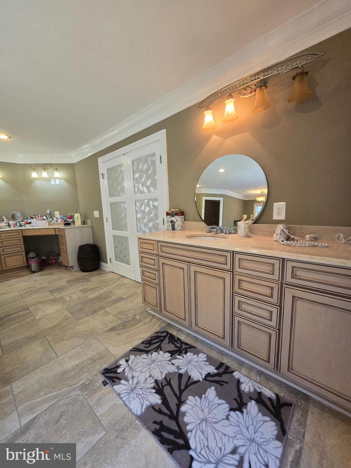 7145 Brooks Road Highland, MD 20777 - Photo 34 of 89 a bathroom with a sink a large mirror and a shower